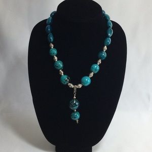 Necklace and earrings handmade in Tagua, a Seed called vegetable ivory.